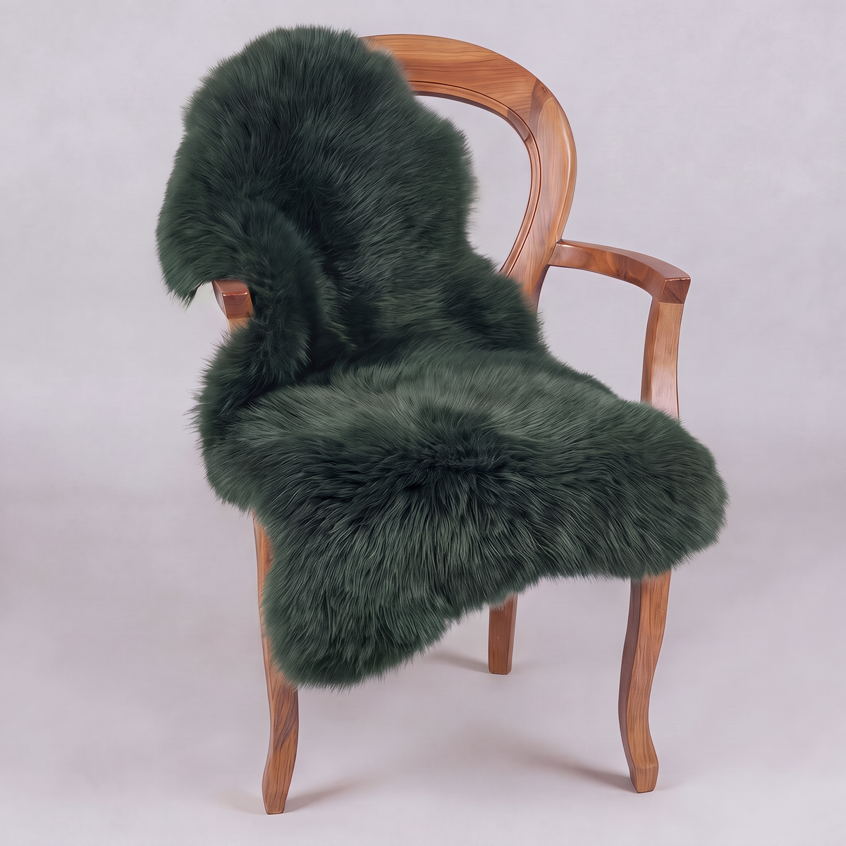 Jungle Green single sheepskin rug draped over a wooden armchair, front three-quarter view