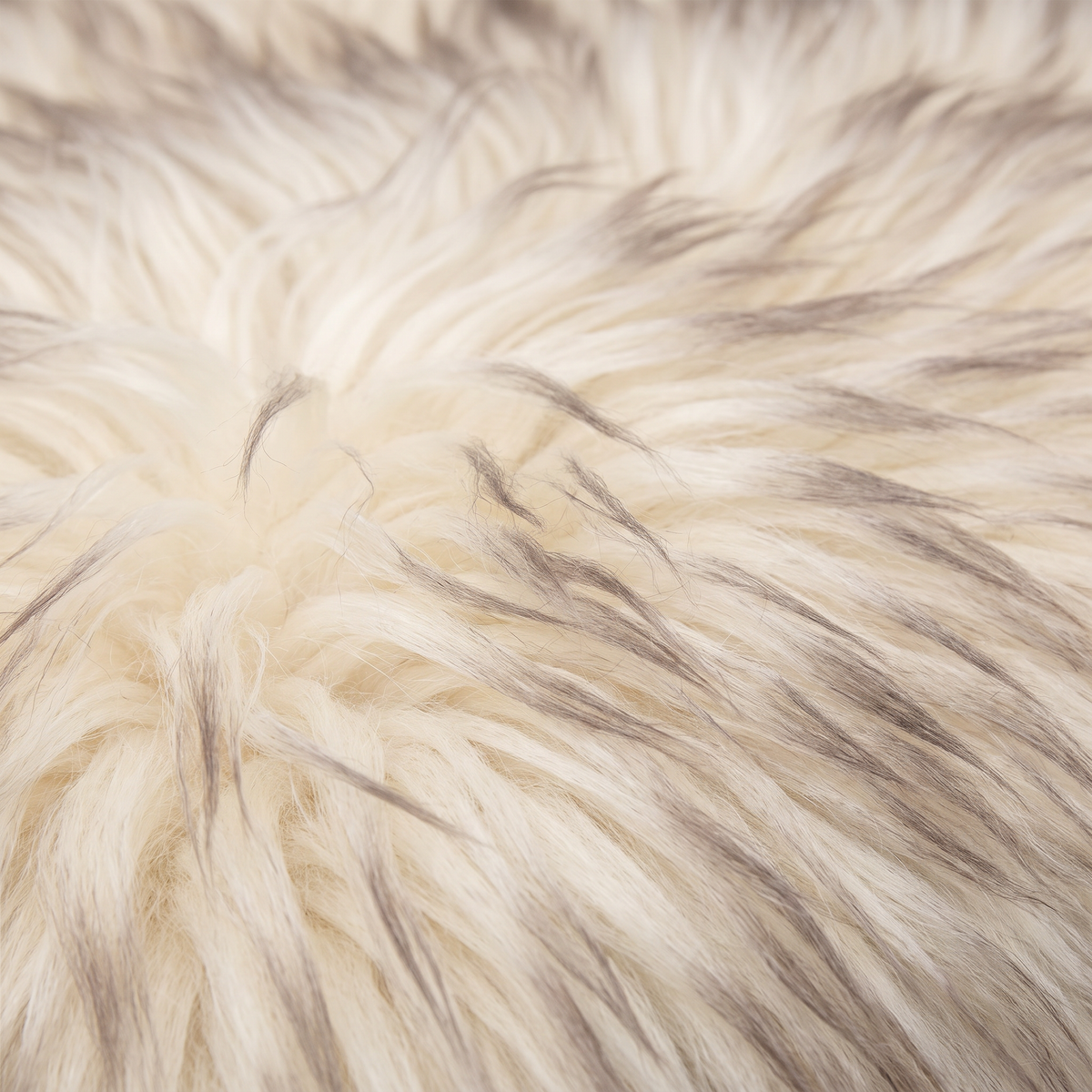 Close-up of Wolf Tip long wool sheepskin fibres with taupe-grey tipping