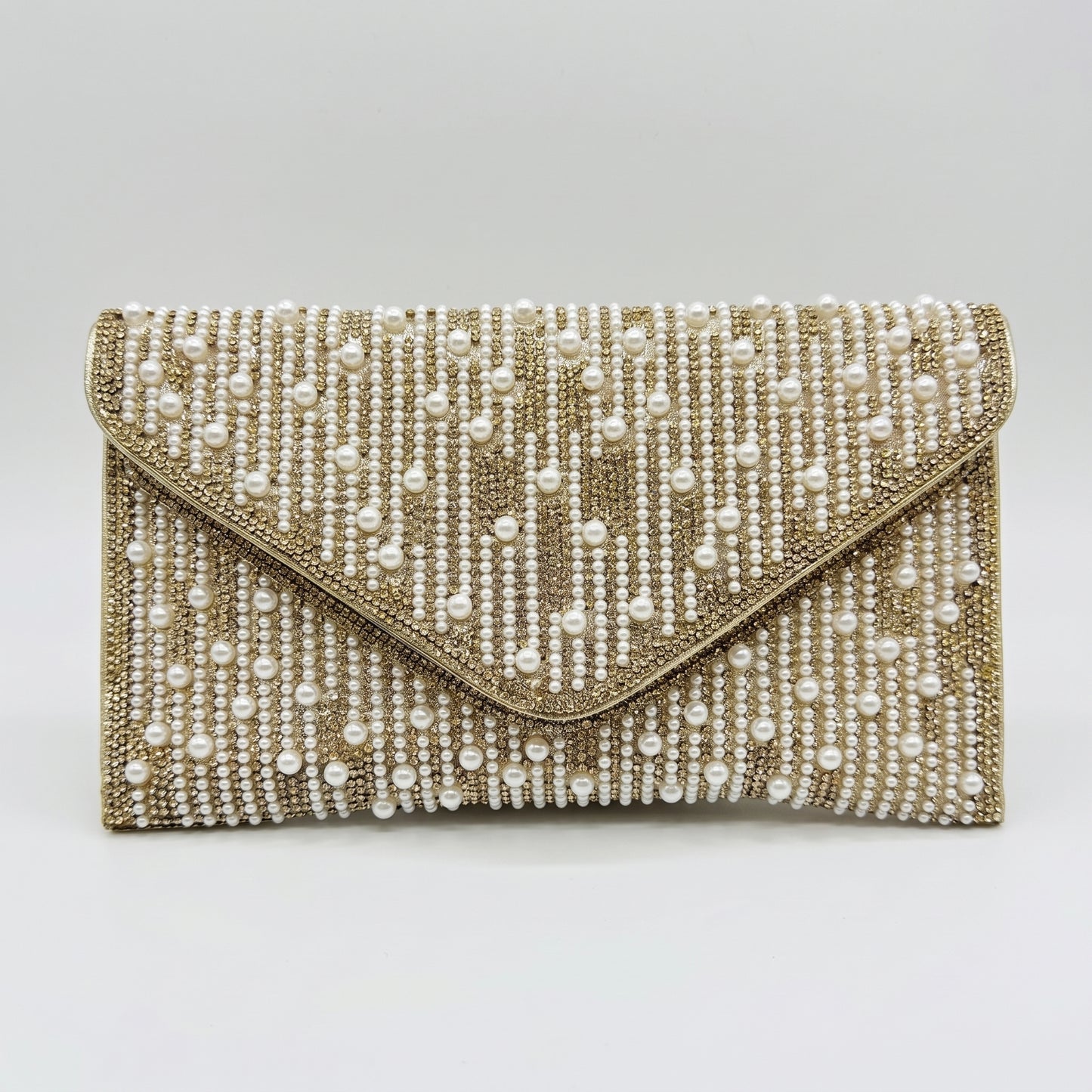 Perlette Pearl & Crystal Envelope Clutch by Clemés in Gold on light grey studio background