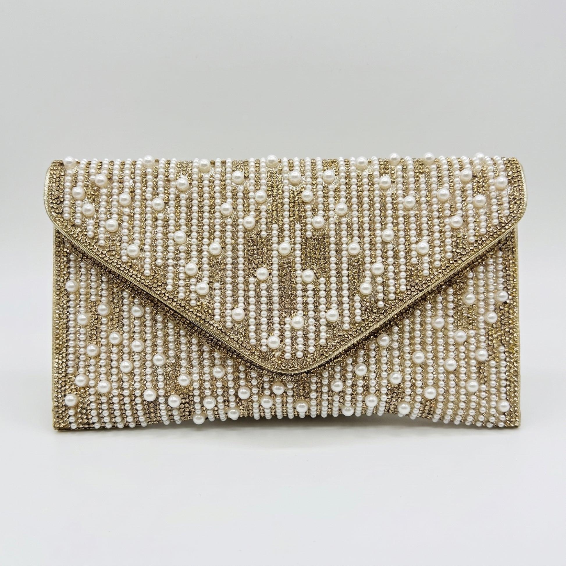 Perlette Pearl & Crystal Envelope Clutch by Clemés in Gold on light grey studio background