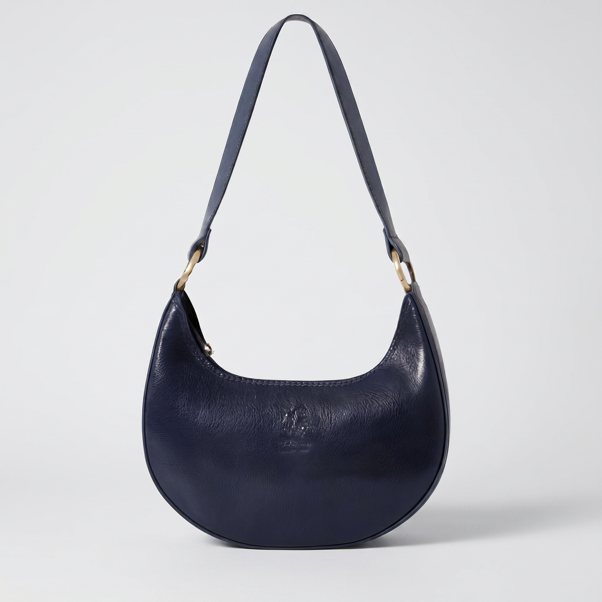 Mezzaluna leather shoulder bag in Navy on light grey studio background