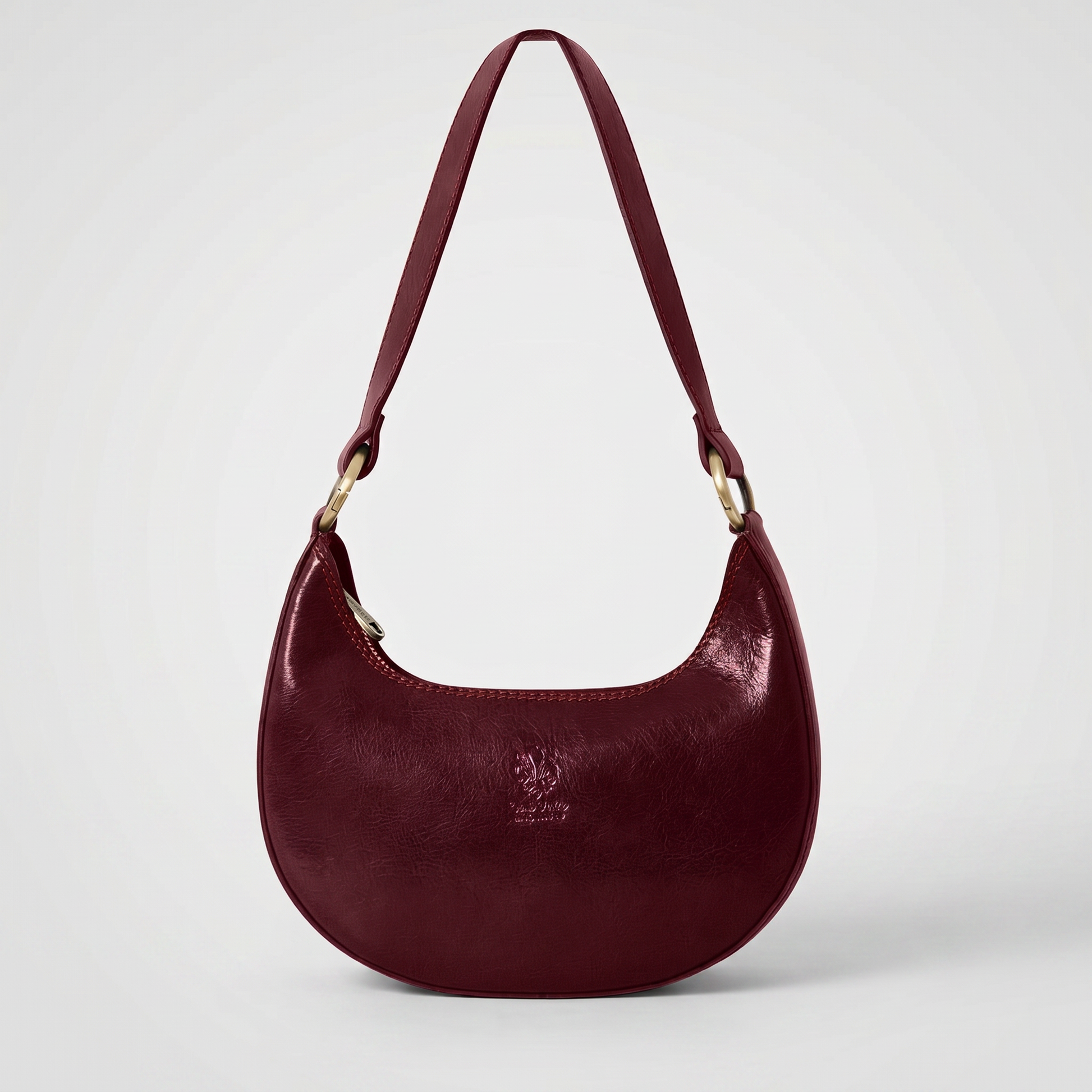 Mezzaluna leather shoulder bag in Mulberry on light grey studio background