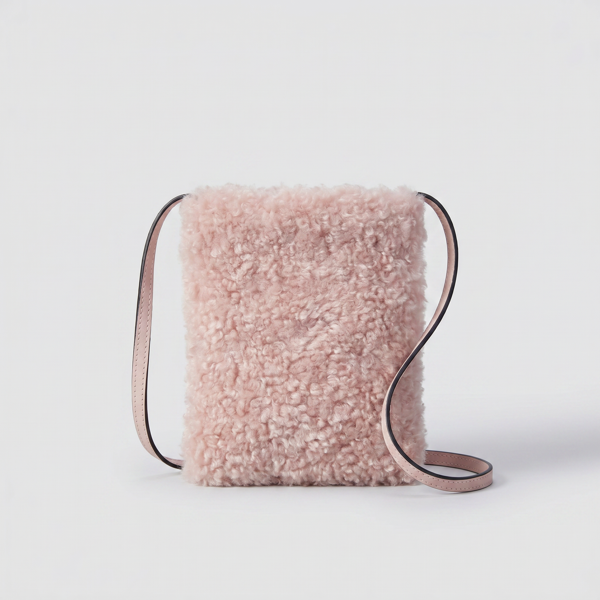 Pia faux shearling crossbody bag in Oyster on light grey studio background