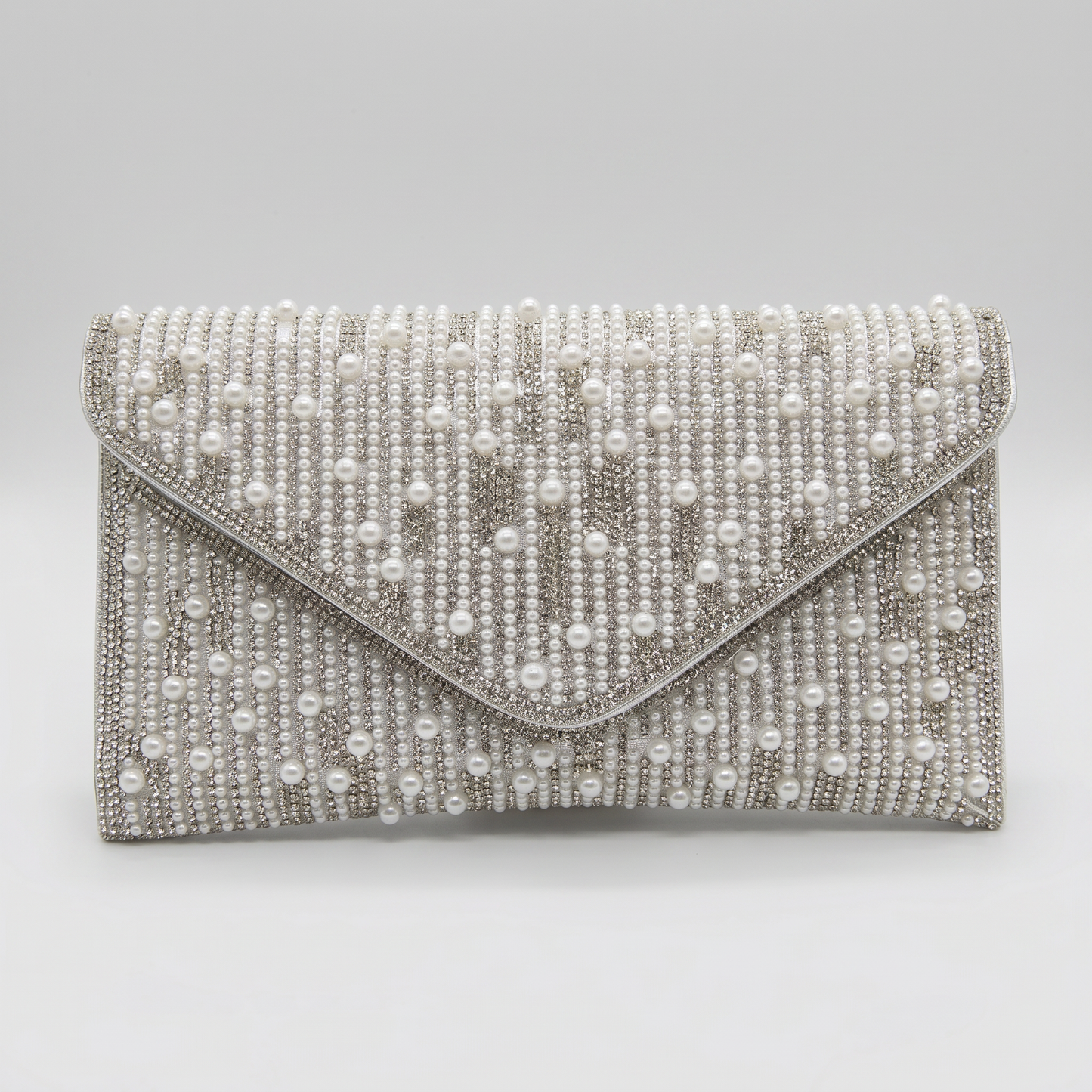 Perlette Pearl & Crystal Envelope Clutch by Clemés in Silver on light grey studio background