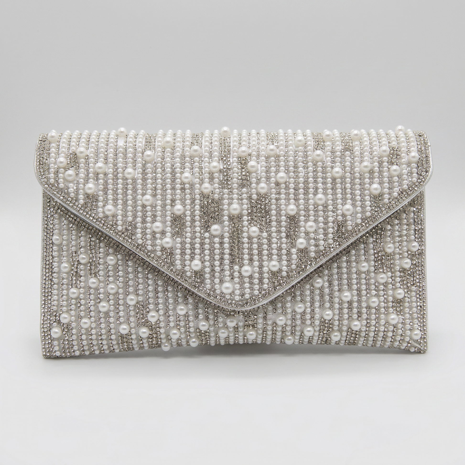 Perlette Pearl & Crystal Envelope Clutch by Clemés in Silver on light grey studio background