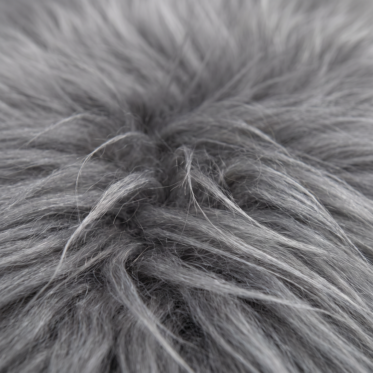 Close-up of grey long wool sheepskin fibres