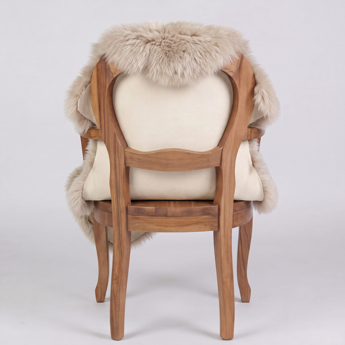 Oyster sheepskin over an armchair back, suede leather underside facing the camera