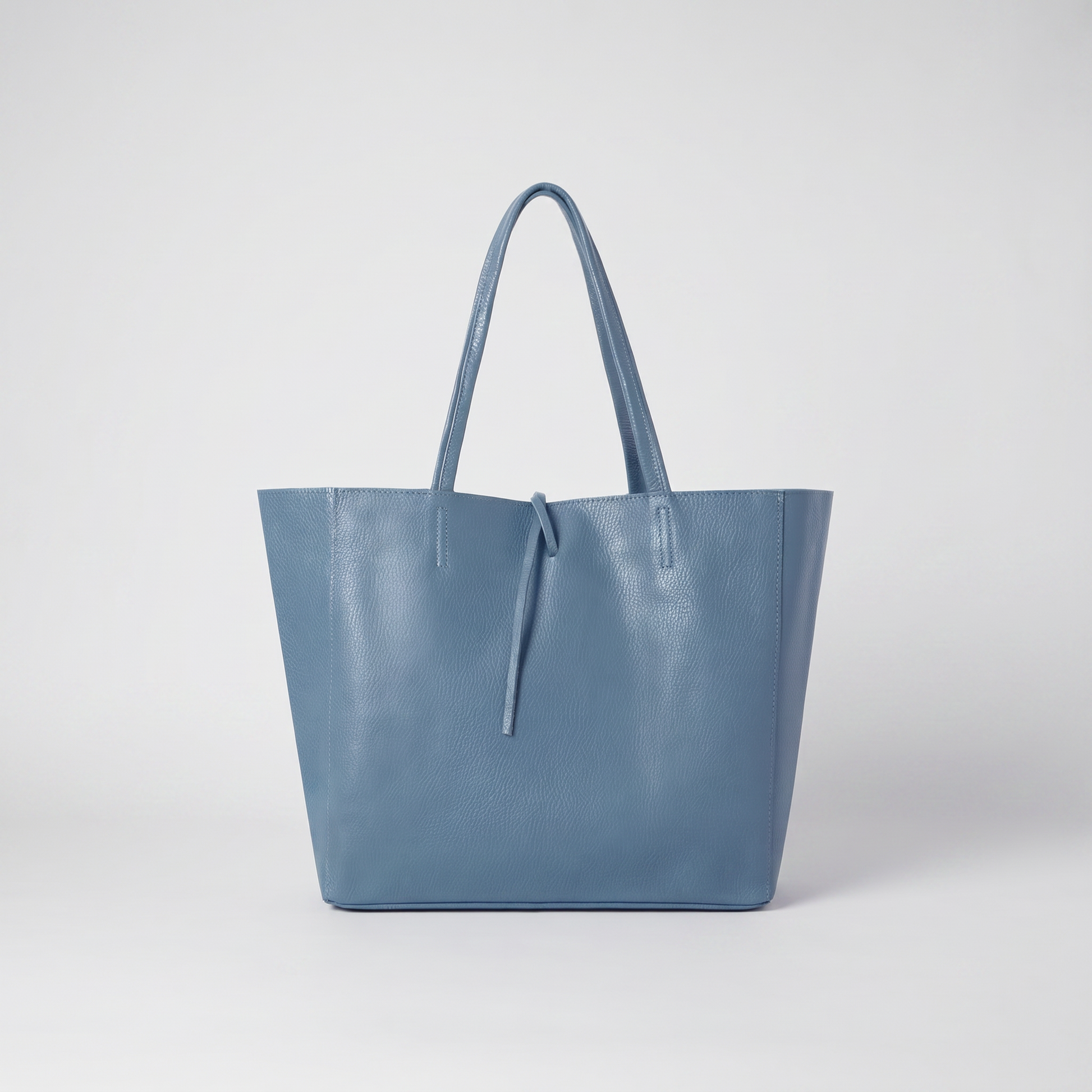 Carlotta Oversized Leather Tote in Denim Blue on light grey studio background