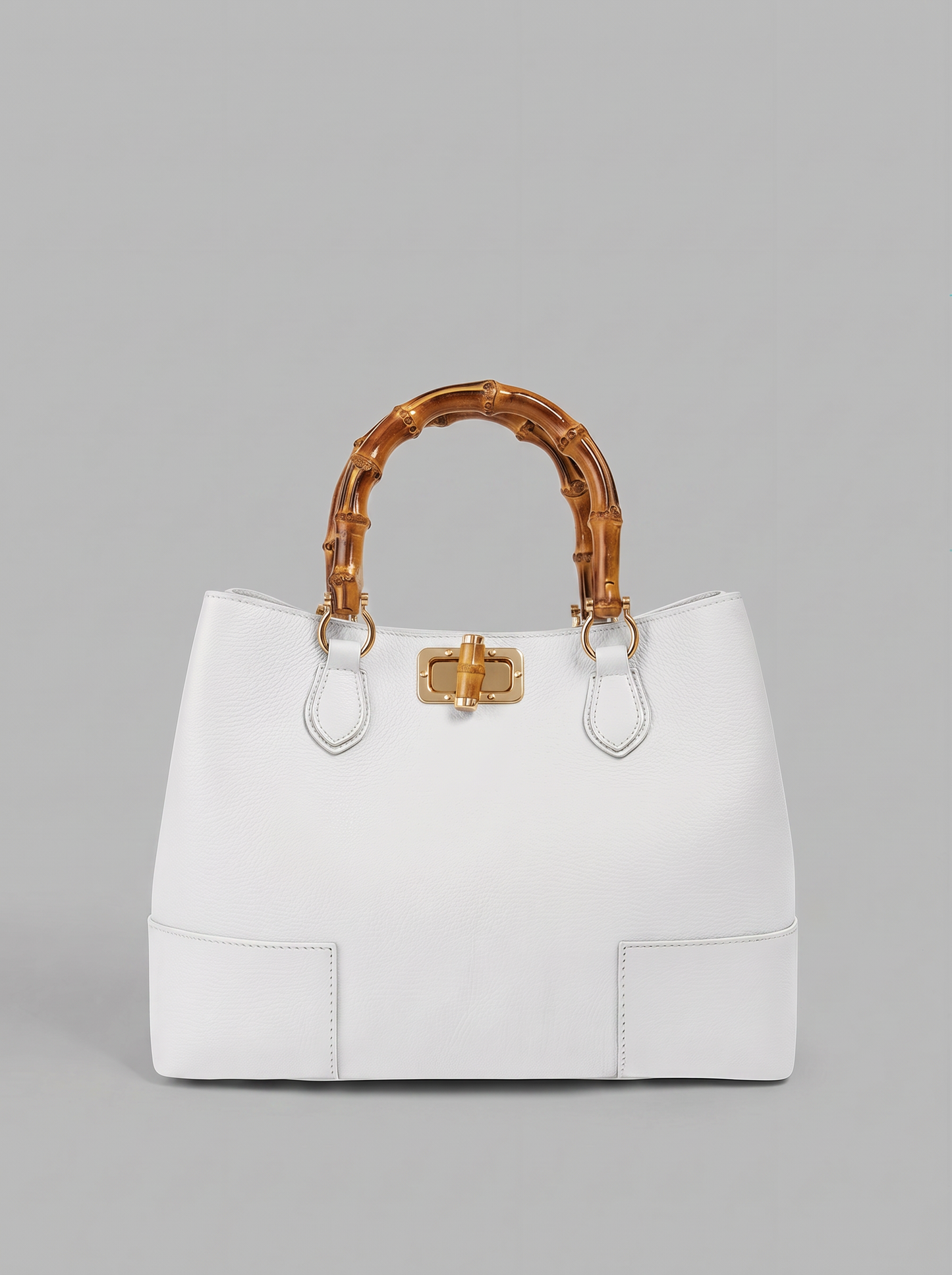 Ginevra Bamboo-Handle Leather Bag by Clemés in White, three-quarter studio shot on grey background
