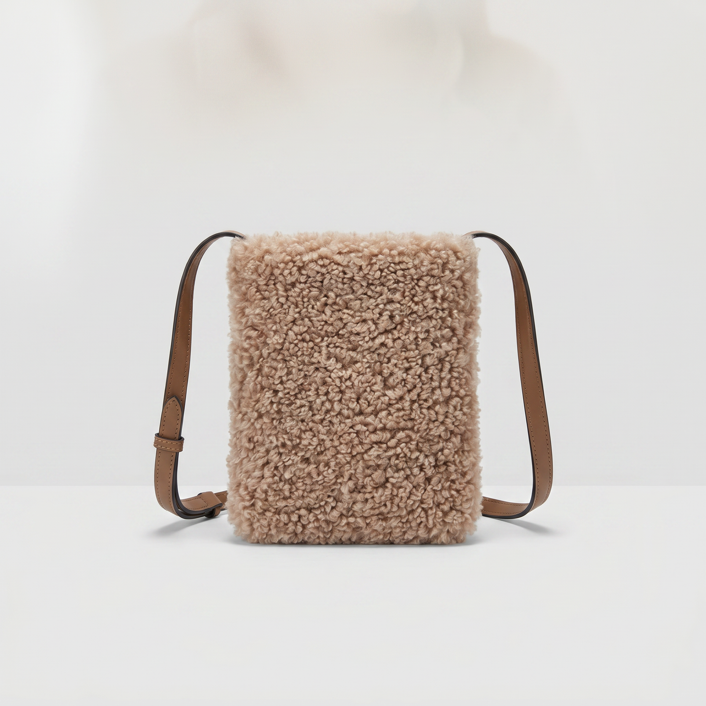 Pia faux shearling crossbody bag in Taupe on light grey studio background