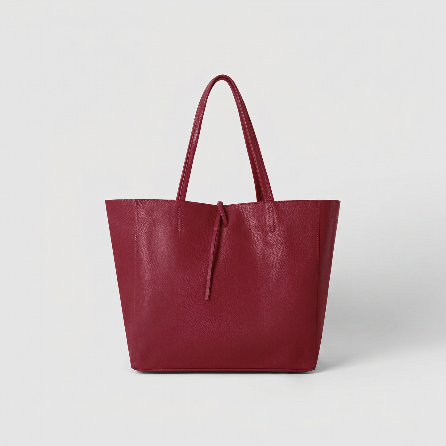Carlotta Oversized Leather Tote in Red Plum on light grey studio background