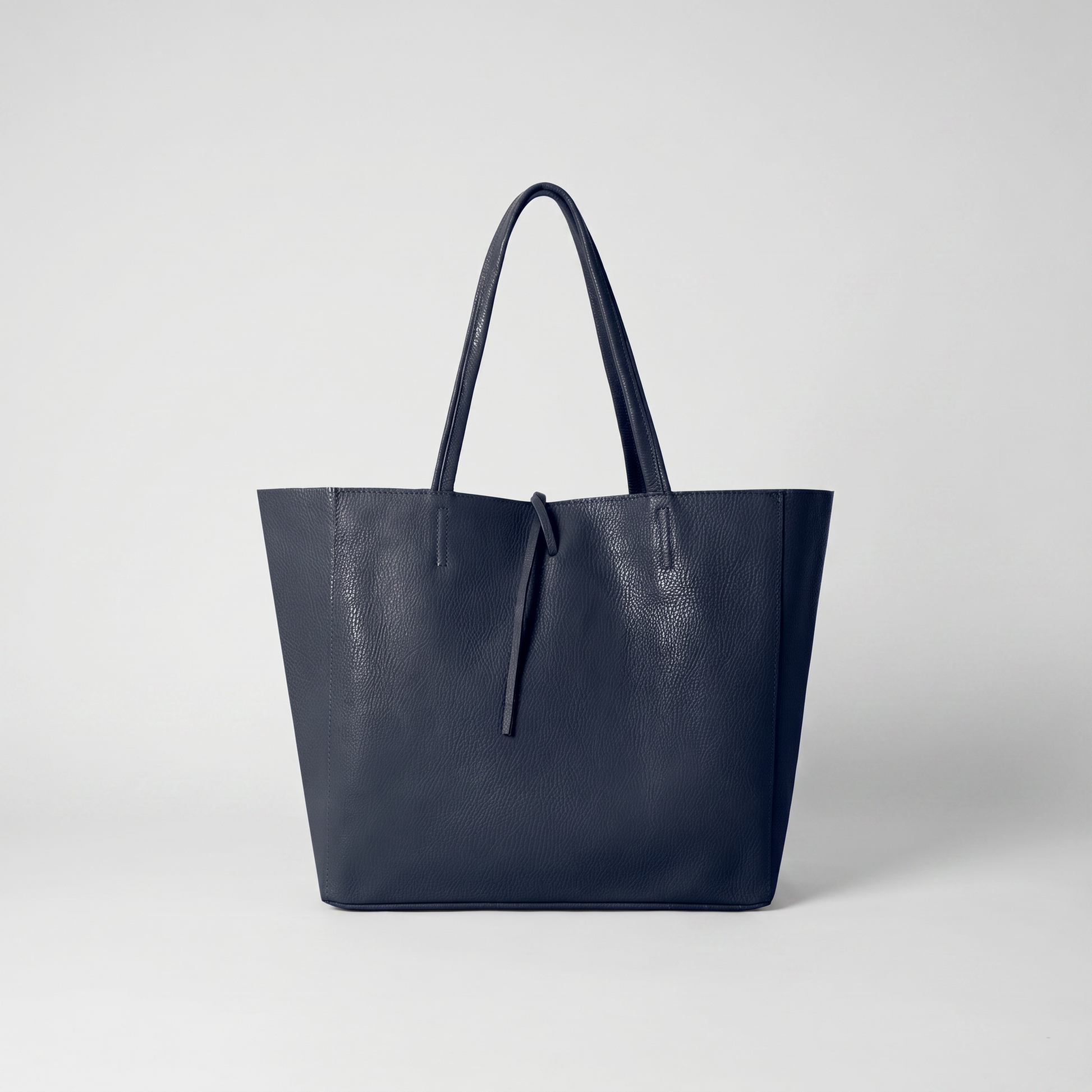 Carlotta Oversized Leather Tote in Navy on light grey studio background