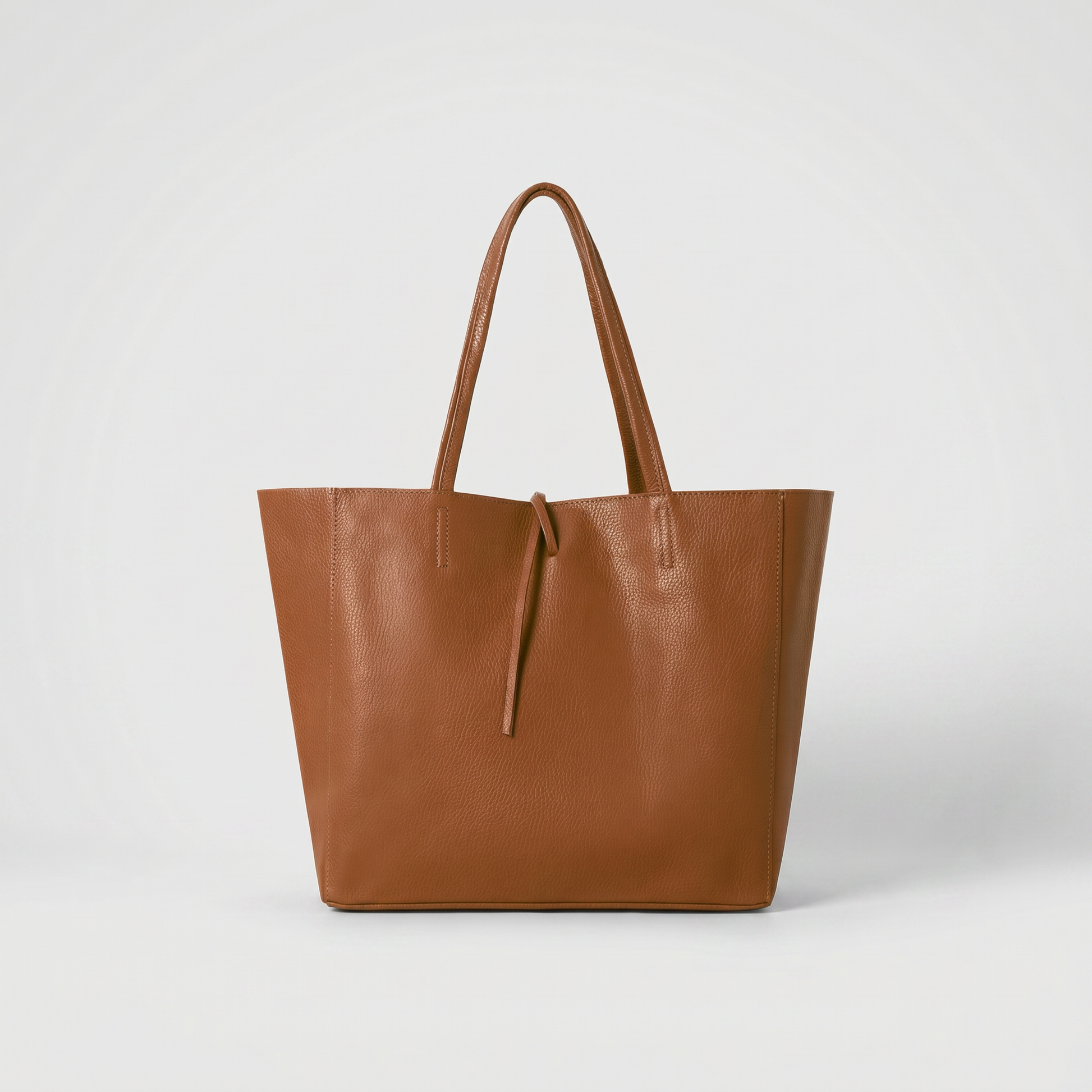 Carlotta Oversized Leather Tote in Dark Tan on light grey studio background