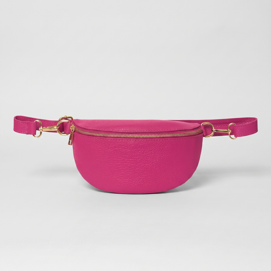 Romy leather crossbody bum bag in Fuchsia on light grey studio background
