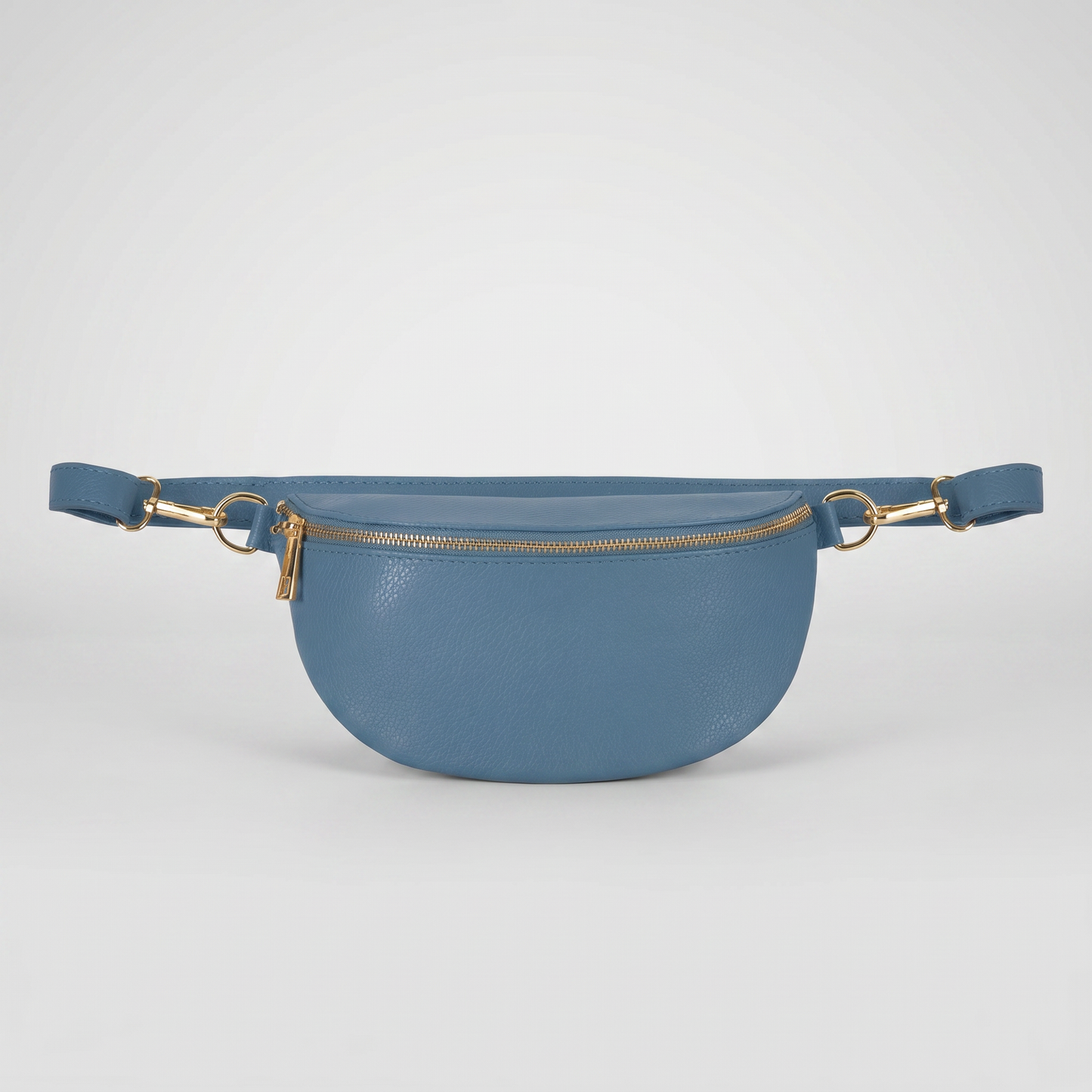 Romy leather crossbody bum bag in Denim Blue on light grey studio background