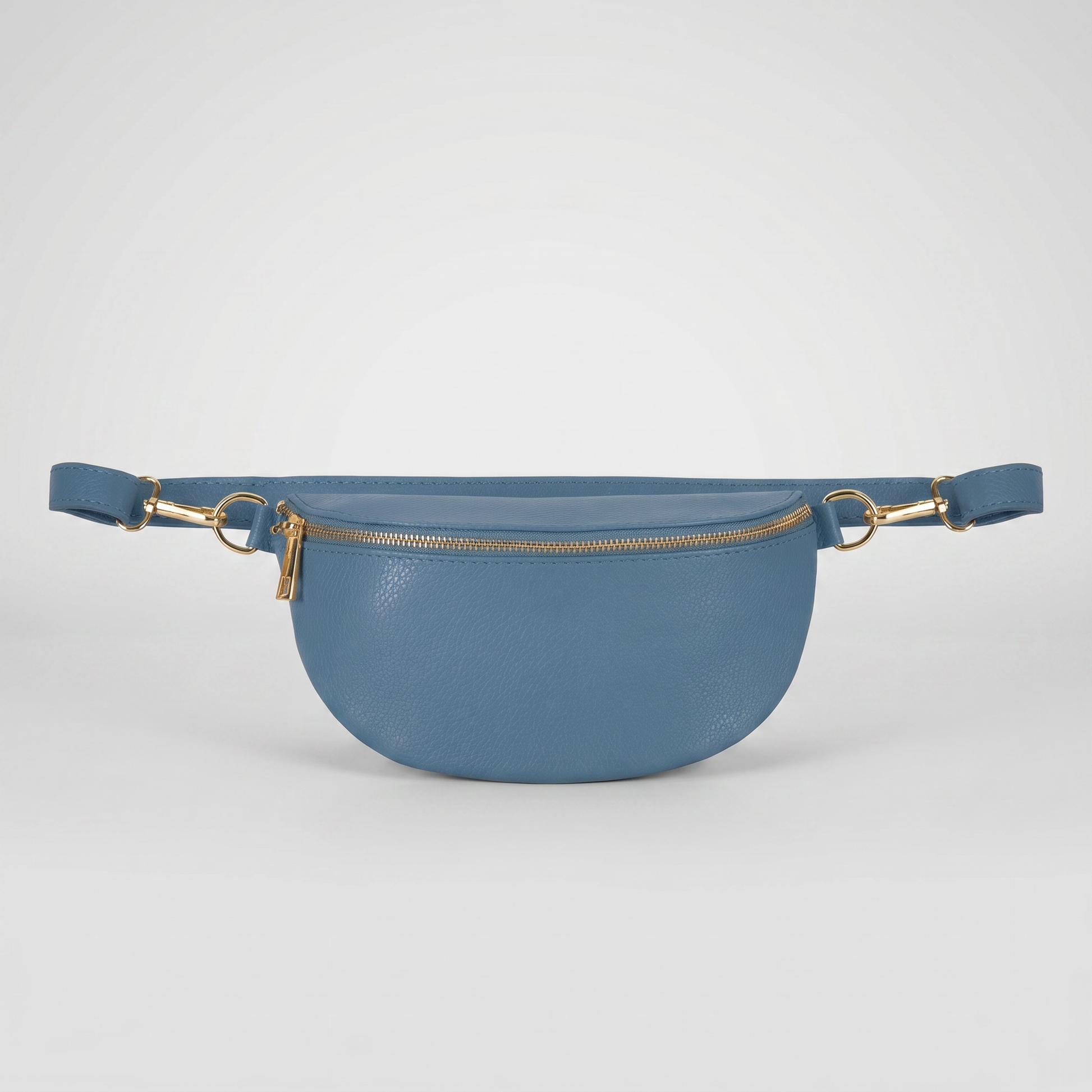 Romy leather crossbody bum bag in Denim Blue on light grey studio background