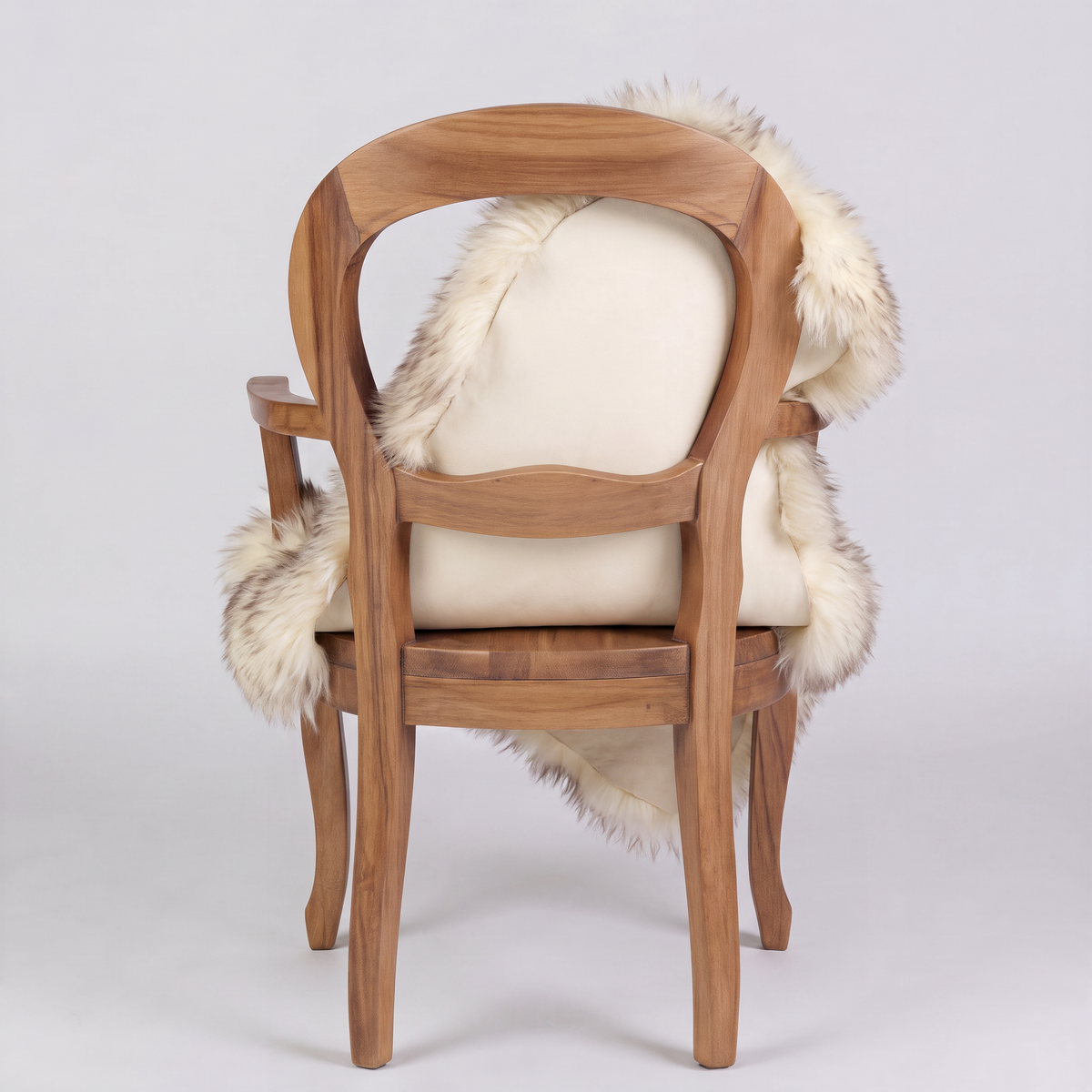 Wolf Tip sheepskin over an armchair back, suede leather underside facing the camera