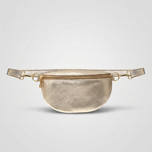 Romy leather crossbody bum bag in Gold on light grey studio background